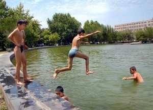 Youngsters take the plunge in an unsanitary fountain in Yerevan.