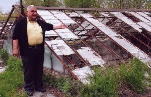 Research director Gagig Movsesyan points to the decrepit condition of a greenhouse nursery at the Institute of Botany in Yerevan.