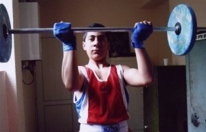 A weightlifter shows off a determined look at the Armenian Boxing School of Yerevan.