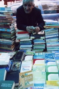 Vendor peddles his books at Vernisage, looking to eke out a living. (Photo by Tom Vartabedian)