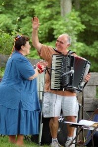 Musician Johnny Arzigian shares a tender moment with his sister Diane during a retirement picnic held in her behalf in Deerfield, N.H.