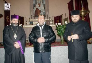 Freed political prisoner Vahagn Chakhalyan (center) visits Holy Etchmiadzin church in Tbilisi.