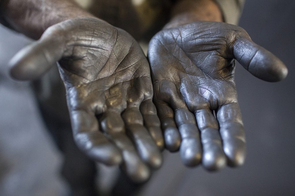 The hands of a mine worker at the molybdenum processing center at the Zangezur Copper-Molybdenum Plant in Kajaran. (Photo by Anahit Hayrapetyan)