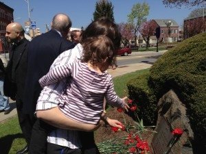 Mother and daughter laying flowers at the Armenian Genocide memorial