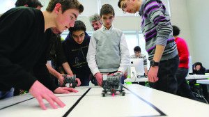 Students experiment in robotics during a workshop at Tumo.