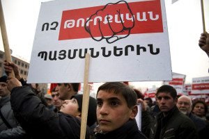 A boy holds a poster that reads, "No to the Turkish preconditions," during a demonstration organized by the ARF in Yerevan, in Jan. 2010. (Photo: Inna Mekhitarian-Hairenik/Armenian Weekly)