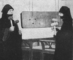 Two St. Catherine's nun-deaconesses pictured with a "wooden bell" (Photo from R. C. Colliver, Persian Women and Their Ways)