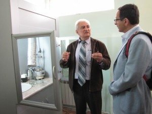 YerPhI’s Medical Isotope Laboratory leader Dr. Avedisyan explains the Technetium extraction setup to Dr. Michael Davoudian, the general director of APAGA Technologies.