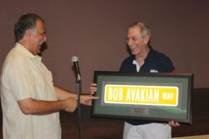 Peter Jelalian presents a replica of the street sign to Honoree Bob Avakian.  (Photo credit: Sevan Donoian)