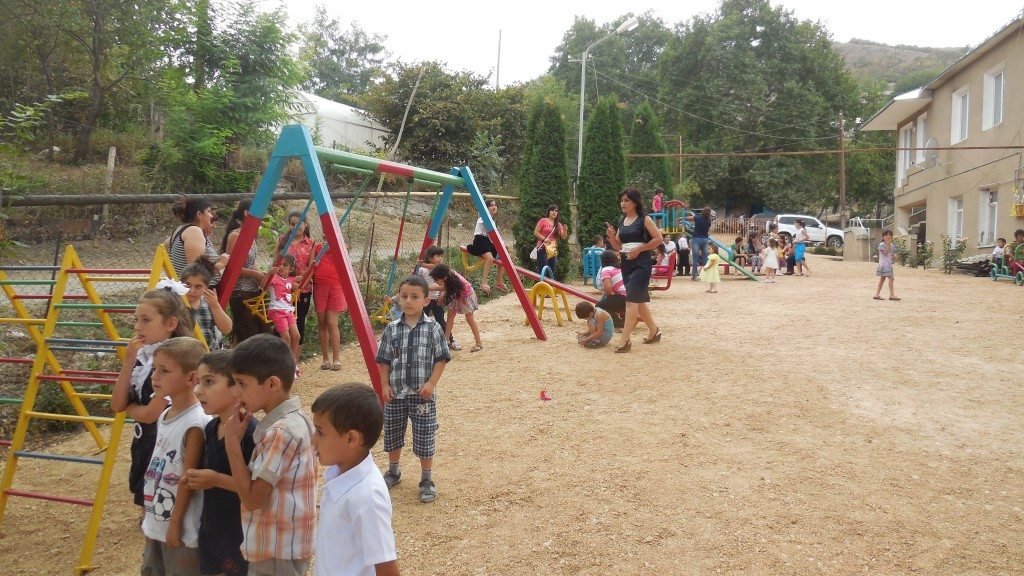 Children enjoying the newly renovated playground at the kindergarten at Nerkin Karmir Aghpyur