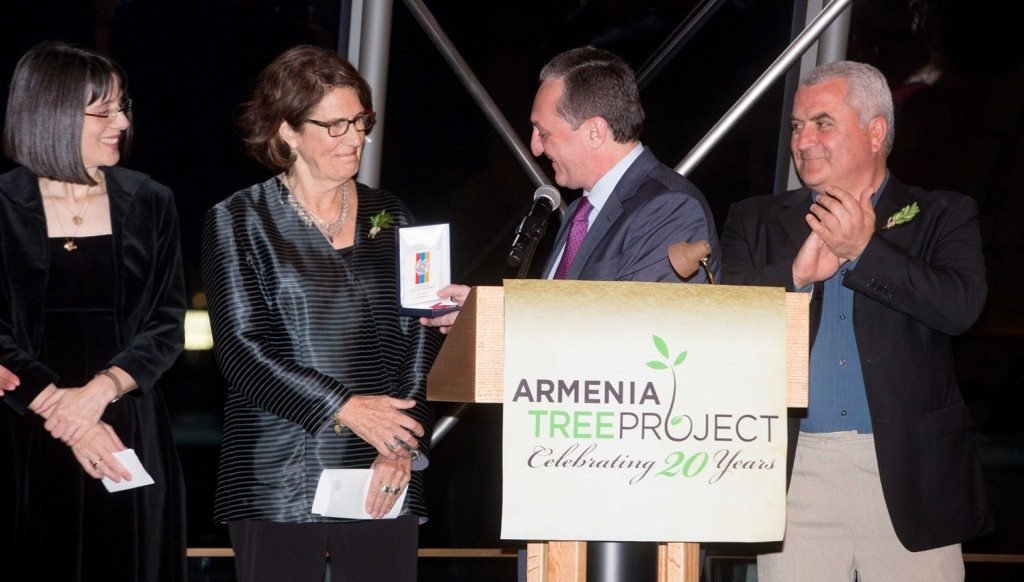 Armenia’s representative to the United Nations, Ambassador Zohrab Mnatsakanyan, presented a Medal for Services Contributed to the Motherland to ATP and its founder, Carolyn Mugar. Also pictured are board member Nancy Kricorian (left) and forestry director Navasard Dadyan. (Photo by Kerry Brett)