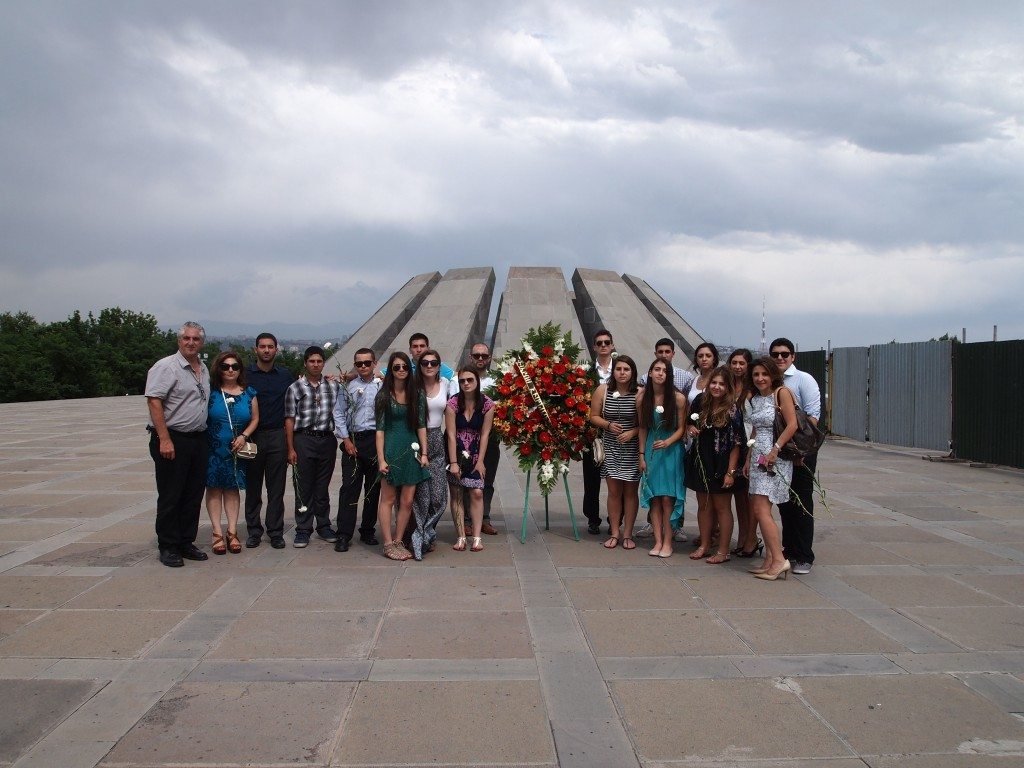 SERVICE Armenia participants and Paros Foundation staff placing a wreath at the Dzidzernagapert Armenian Genocide Monument in the summer of 2014