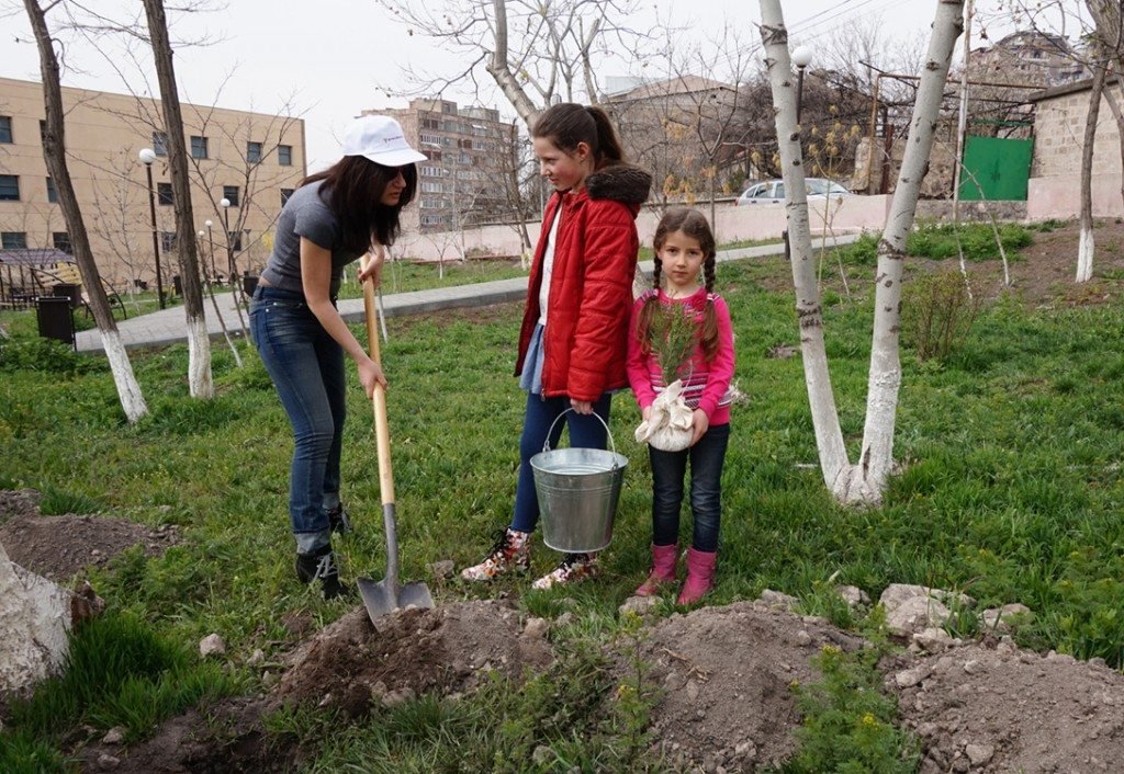 Spring means tree planting in Armenia; in this photo, Byblos Bank employees and their families joined ATP to plant trees on the campus of American University of Armenia.