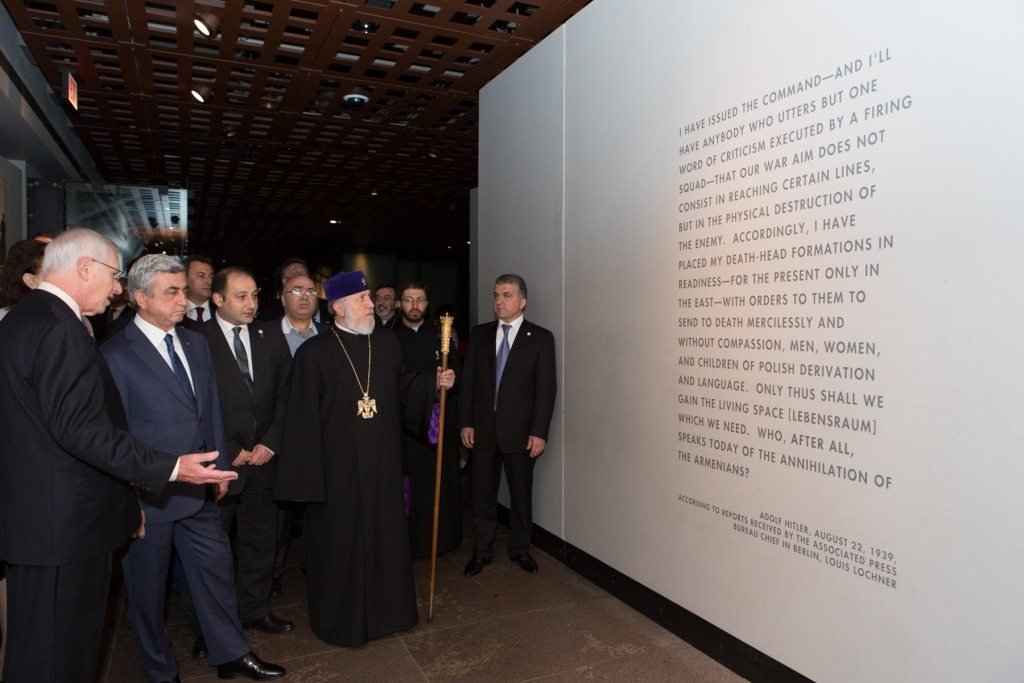 Arthur Berger, Senior Advisor to the United States Holocaust Memorial Museum, leads Armenian President Serge Sarkisian; His Holiness Karekin II, Supreme Patriarch and Catholicos of All Armenians; the Armenian Foreign Minister and Minister of Diaspora Affairs; Archbishop Khajag Barsamian, the Primate of the Eastern Diocese; and others stand in front of a quote from Adolf Hitler that references the Armenian Genocide. (Photo: U.S. Holocaust Memorial Museum)