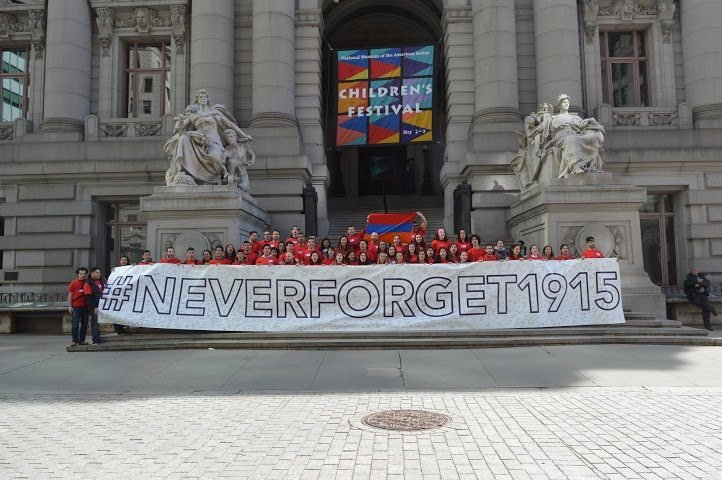 The 40-foot long #NeverForget1915 banner became a tourist attraction in its own right.