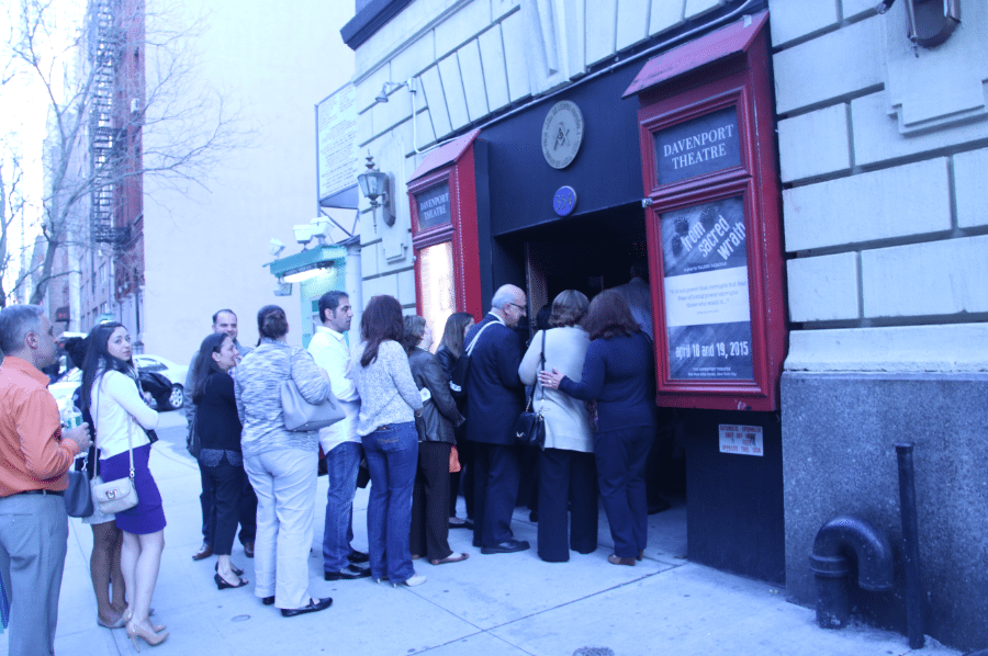 A crowd gathers outside the Davenport Theatre pre-show