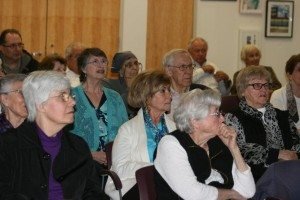Adults catch one of two genocide talks given at the Chelmsford Public Library.