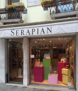 A luxury leather works store named Serapian