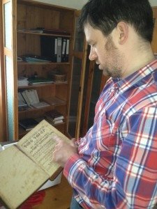 Balint Kovacs thumbs through 'Mirror without Macula,' perhaps the only manuscript written in Armeno-Hungarian
