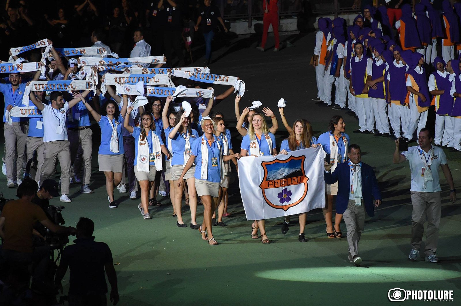 Teams Bitlis and Sasun entering the stadium at the opening ceremony