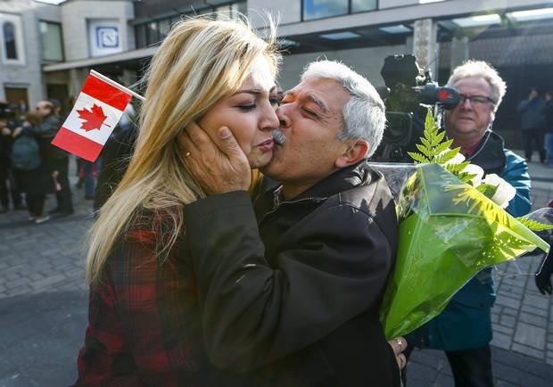 Maria Karageozian is reunited with her father Hagop, a Syrian refugee, at the Armenian Community Center of Toronto (Photo: Mark Blinch/Reuters)