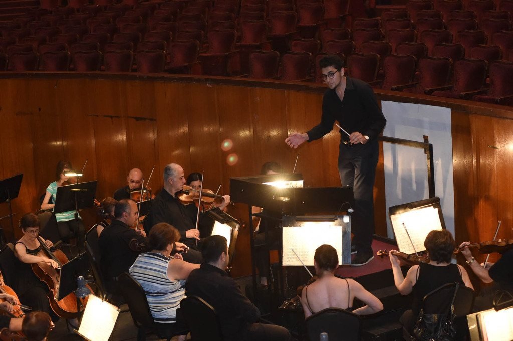 Jasper Moss, a student at McGill University in Montreal, Canada, conducting the Yerevan State Opera and Ballet Orchestra during a rehearsal, as part of his studies as a MAP participant