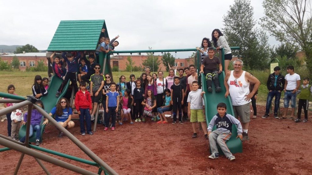 'SERVICE Armenia’ participants and local children in Vanadzor following the construction of the Vanadzor Park play structure