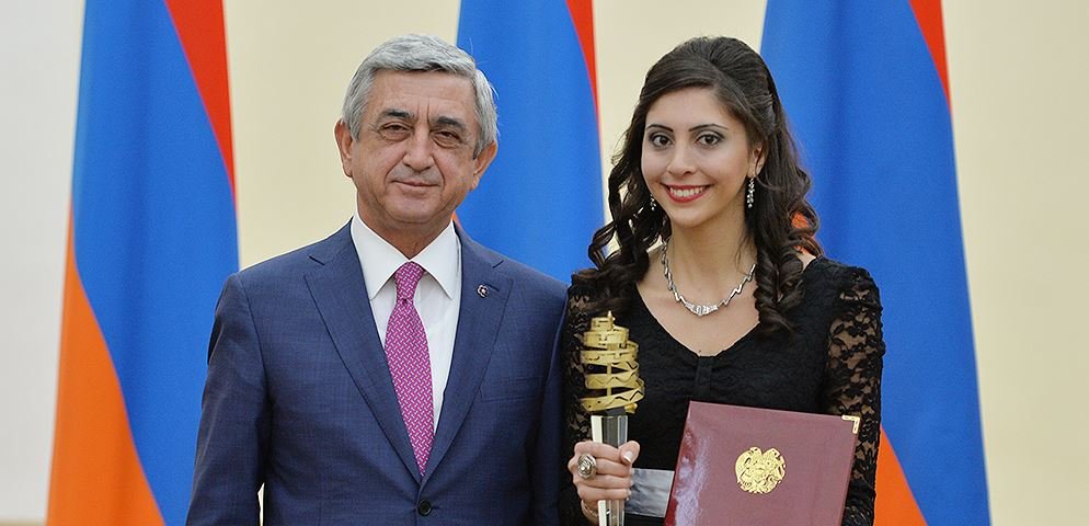 Gasia Atashian, who escaped the war in Syria in 2013, excels academically as a sophomore in AUA's Department of Computational Sciences. She is shown here posing with President of the Republic of Armenia Serge Sarkisian, who awarded her with a highly competitive prize for her educational accomplishments in IT.