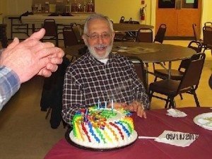 Varoujan “Val” Asbedian is applauded at a recent 76th birthday party in North Andover.