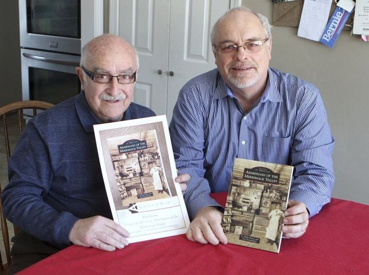 Tom Vartabedian, left, and Haverhill High teacher E. Philip Brown show off the book they co-produced on Armenians in the Merrimack Valley. (Photo: Amy Sweeney/Haverhill Gazette Staff)