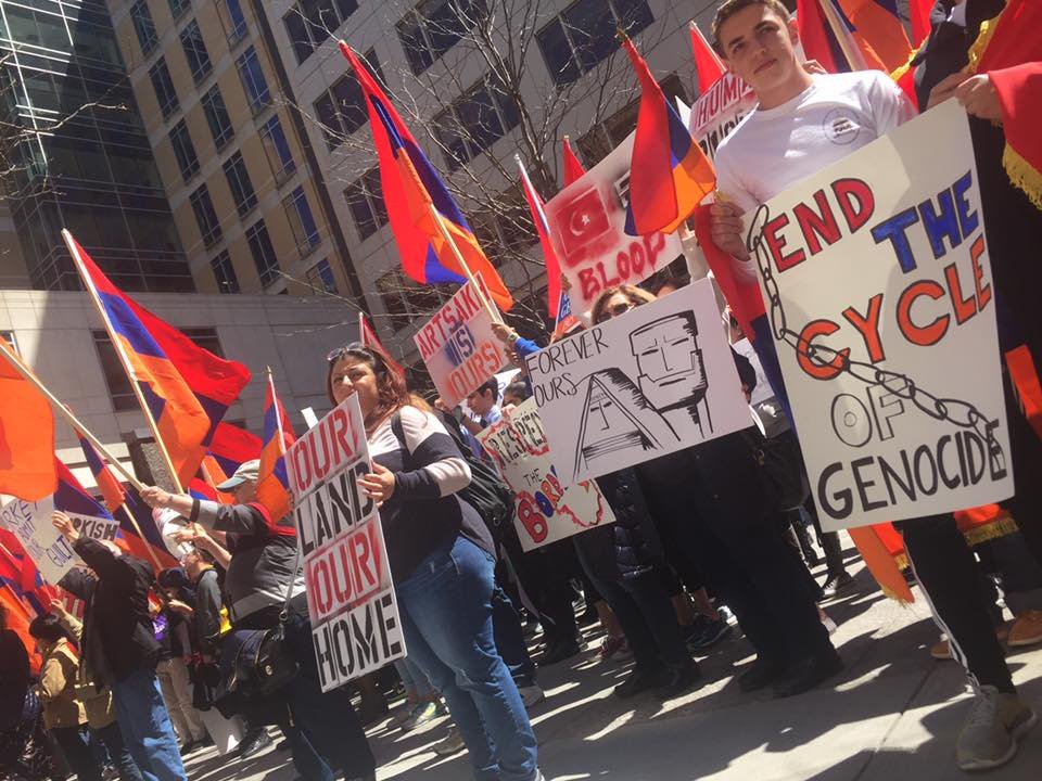 Hundreds of activists holding Armenian tri-colors, posters, and banners, held a protest in front of the Turkish Consulate in Boston on April 24. (Photo: Rupen Janbazian)