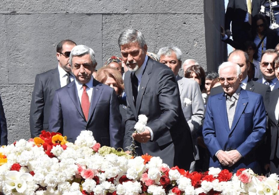 Clooney laid flowers at the eternal flame, joined by Sarkisian and others. (Photo: Yerkir Media)