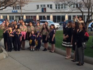 The Homenetmen Scouts with the three singers as the flag is being raised at Cranston City Hall
