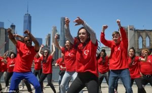 A young dance group donning t-shirts of the Turkish flag and the phrase “Truth = Peace” performing in Brooklyn (Photo: Anadolu) 