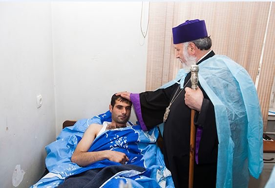 Catholicos Karekin II offering his blessing to a wounded solider (Photo: armenianchurch.org)