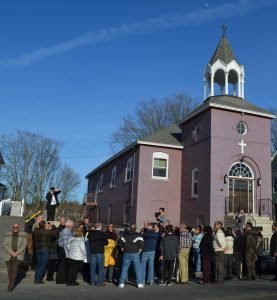 Parishioners tour the exterior of the original Sts. Vartanantz Church in Lowell