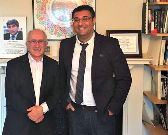 Clark University Ph.D. graduate Umit Kurt, right, stands with Taner Akcam, Clark professor of history and Kaloosdian/Mugar Chair in Armenian Genocide Studies, at the Strassler Center for Holocaust and Genocide Studies.