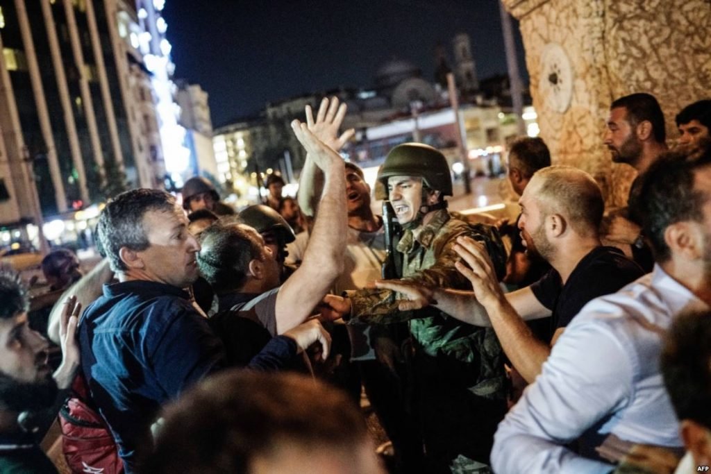 Civilians swarming soldiers who had taken up posts on Taksim Square (Photo: AFP)