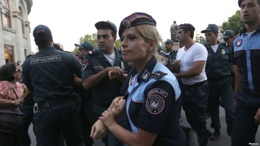 Riot police stopped more than 100 people from marching to a police station in Yerevan. (Photo: Photolure) 