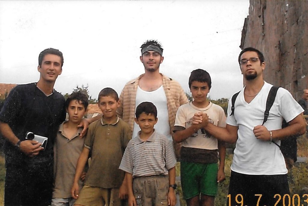 Hovig Apo Saghdejian and fellow Land and Culture Organization (LCO) volunteers with the children of Ayroum where they were working during the summer of 2003