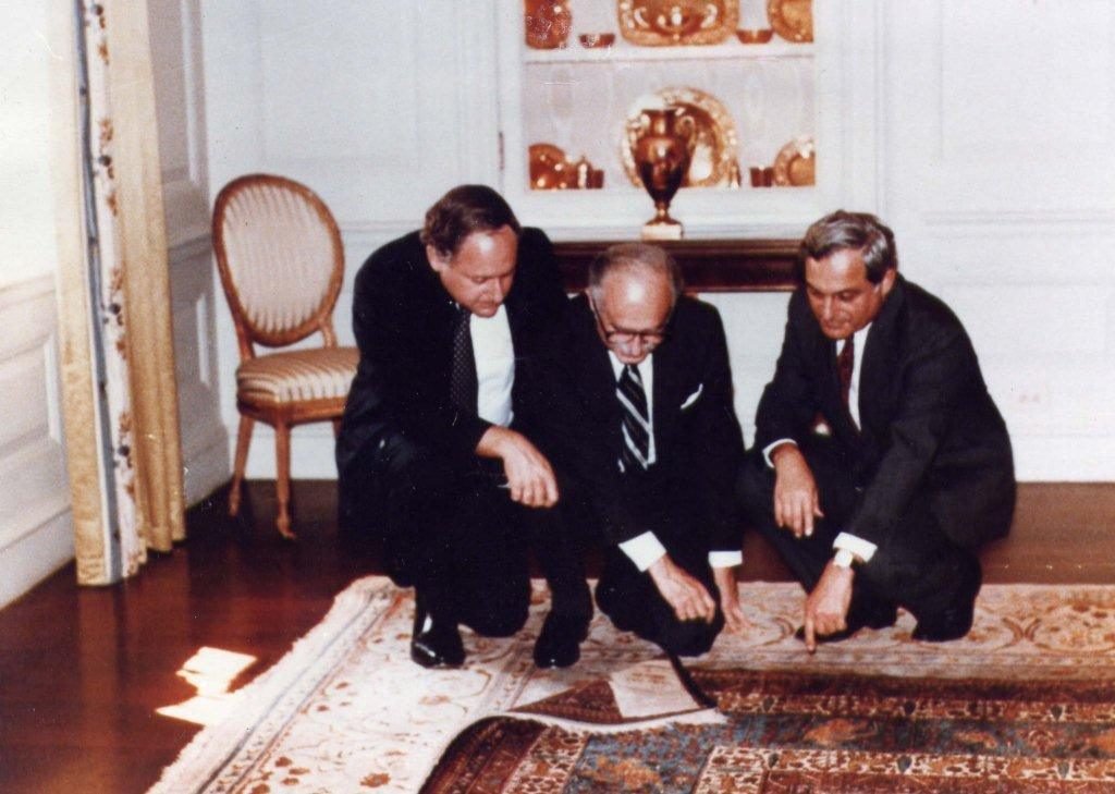 The Armenian Orphan Rug is viewed inside the White House in September 1984 by activists looking to preserve its identity. (L-R) U. S. Senator Carl Levin (D-Mich.), Dr. H. Martin Deranian, and Set Momjian, a former ambassador to the UN